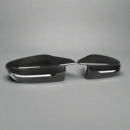 Two black car side mirrors on a white background