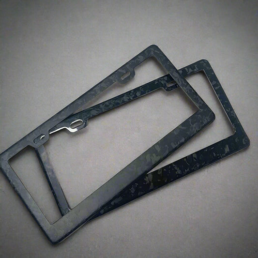 Two black license plate frames on a white background