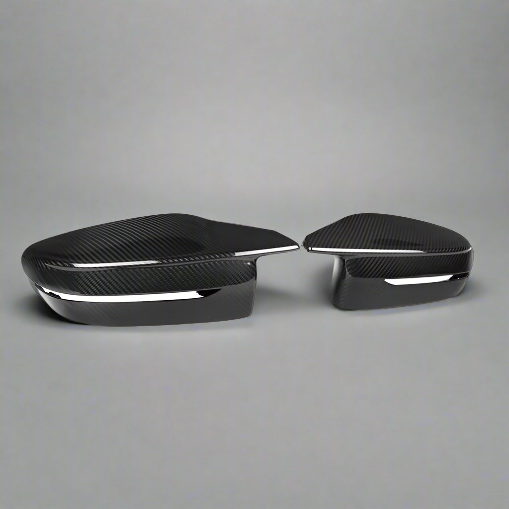 Two black car side mirrors on a white background